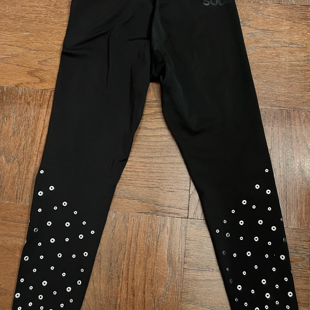 SoulCycle black leggings with silver grommets